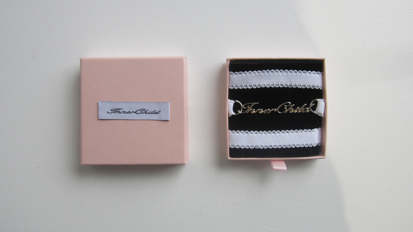 inner child logo charm leg strap